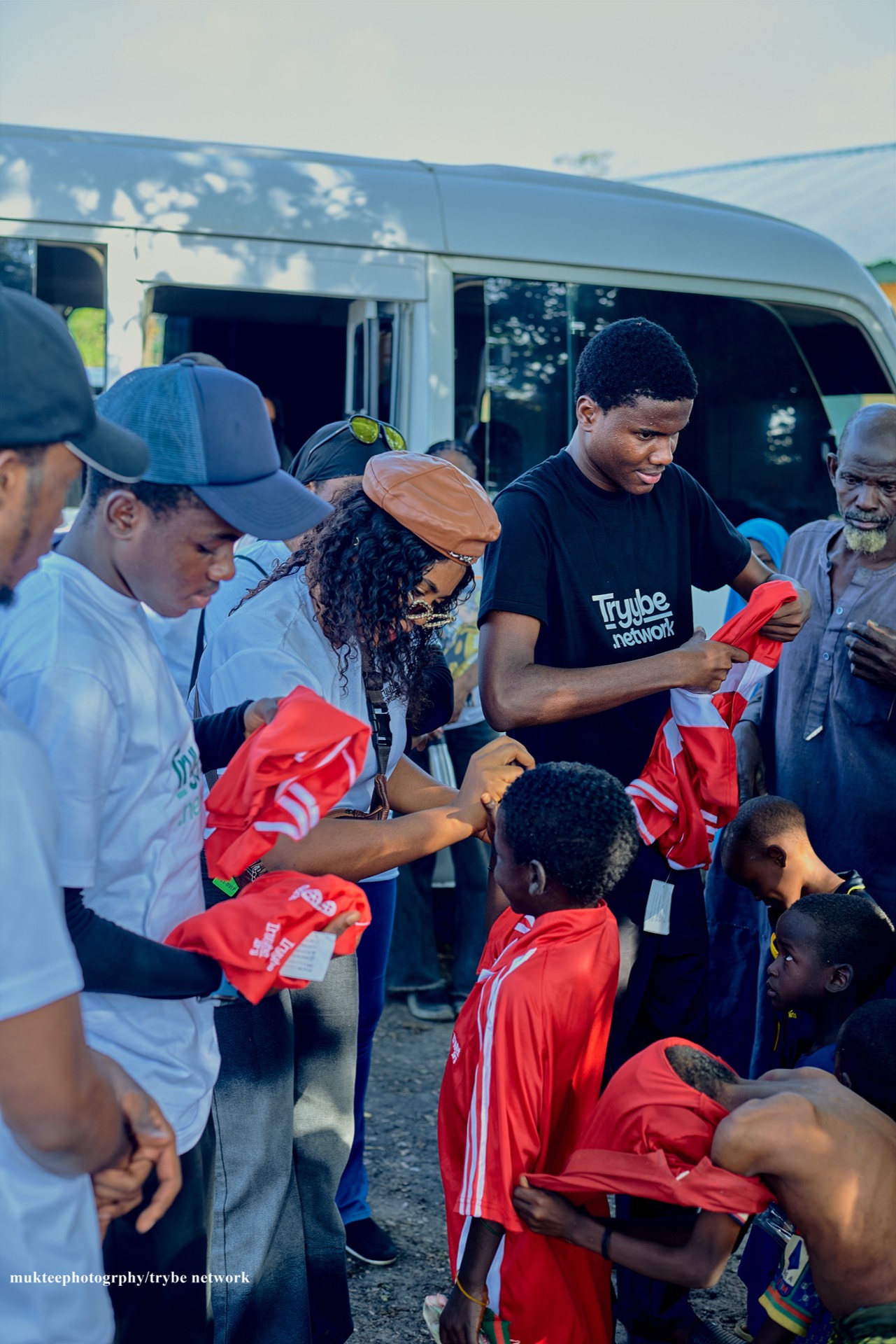 The Tryybe team giving clothes to the poor