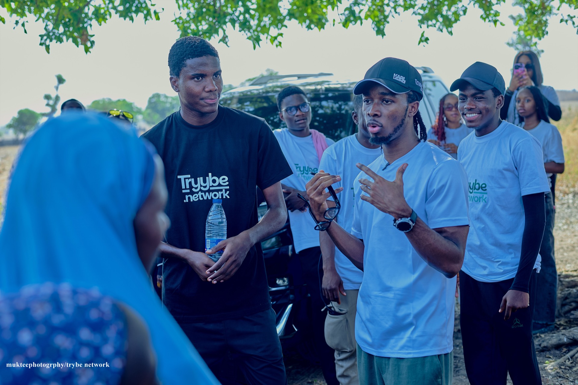 Joshua Brendan with the Tryybe team addressing beneficiaries